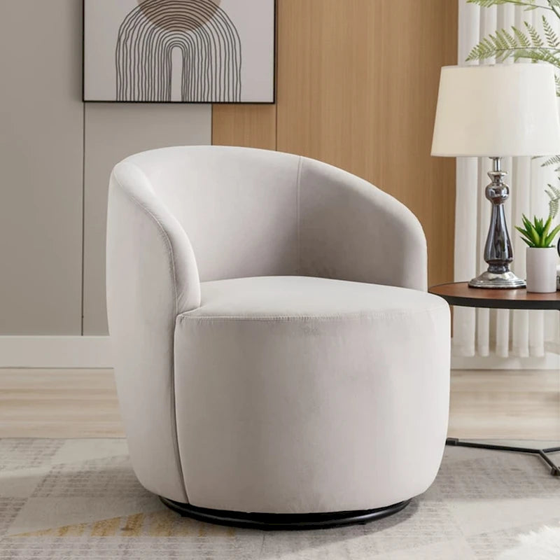 Sillón tipo barril giratorio de terciopelo con respaldo curvado y base negra
