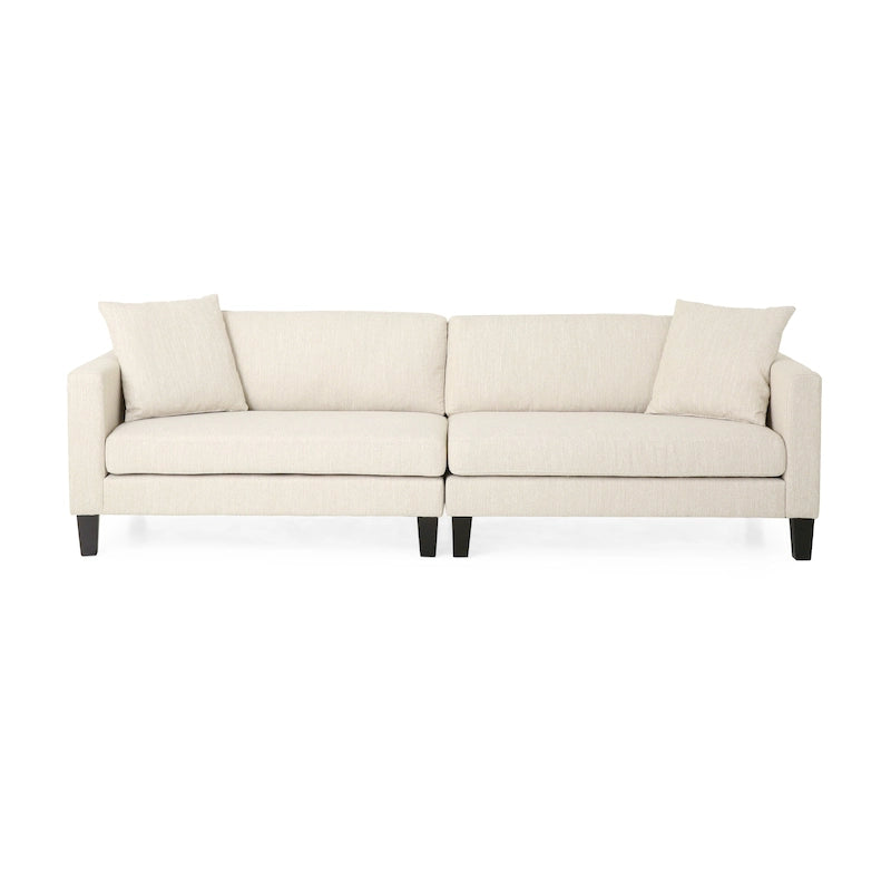 Modernes Stoffsofa mit Dekokissen und konisch zulaufenden Beinen aus Birkenholz