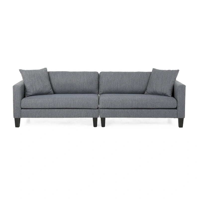 Modernes Stoffsofa mit Dekokissen und konisch zulaufenden Beinen aus Birkenholz