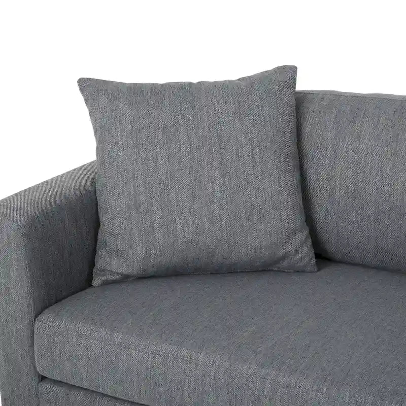 Modernes Stoffsofa mit Dekokissen und konisch zulaufenden Beinen aus Birkenholz