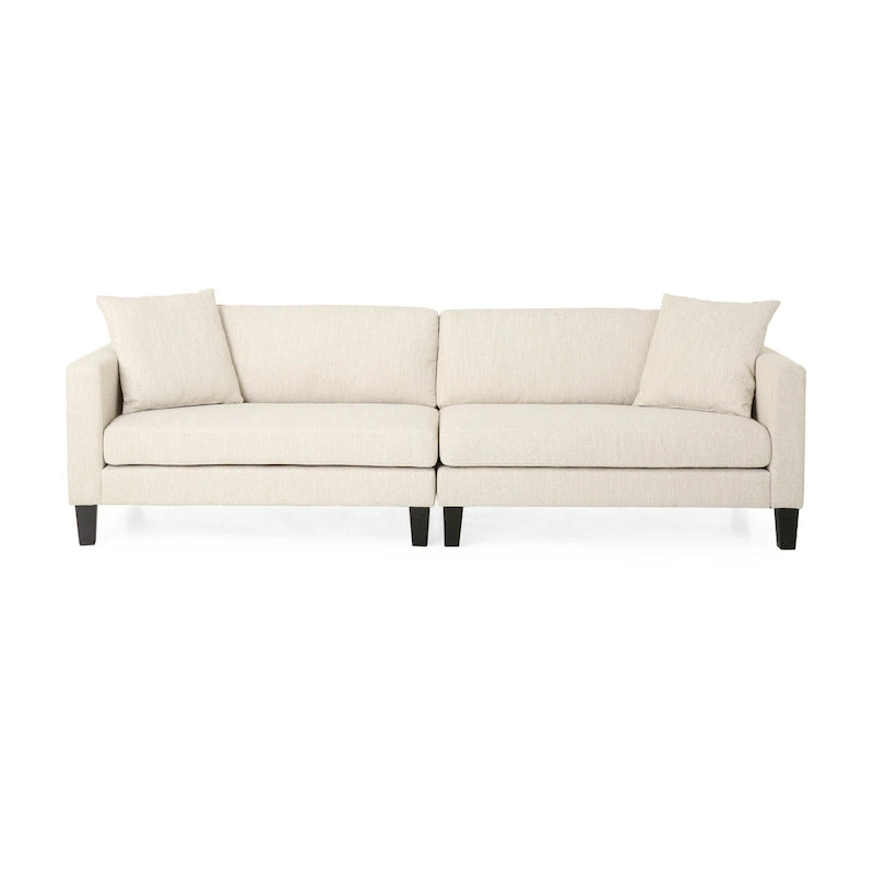 Modernes Stoffsofa mit Dekokissen und konisch zulaufenden Beinen aus Birkenholz