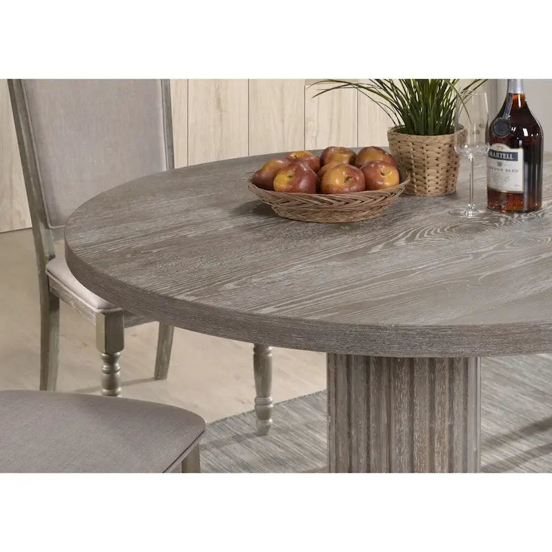 Mesa de comedor redonda rústica gris de madera con base de pedestal estriada
