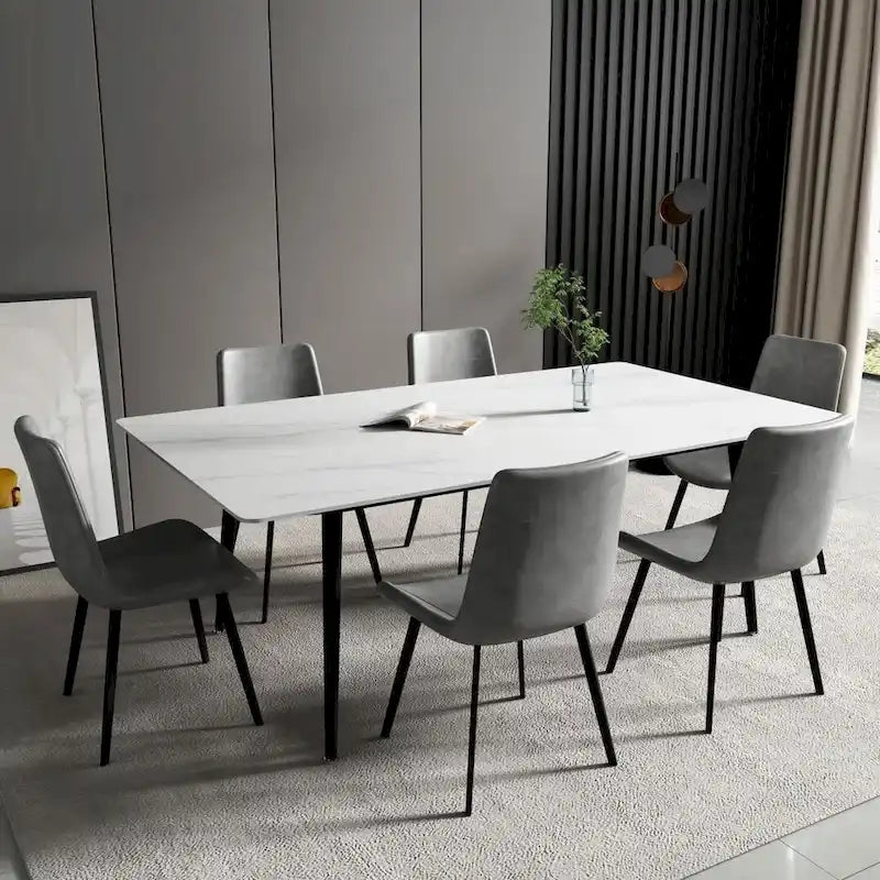 Mesa de comedor rectangular moderna con superficie de piedra y patas de acero negro