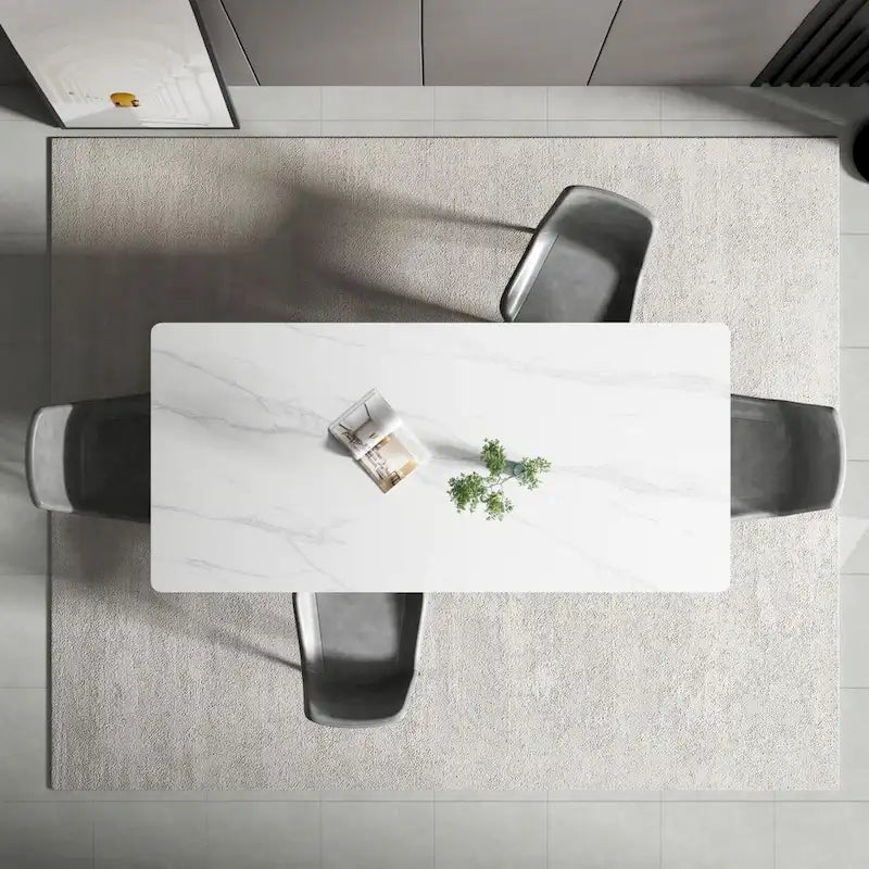 Mesa de comedor rectangular moderna con superficie de piedra y patas de acero negro