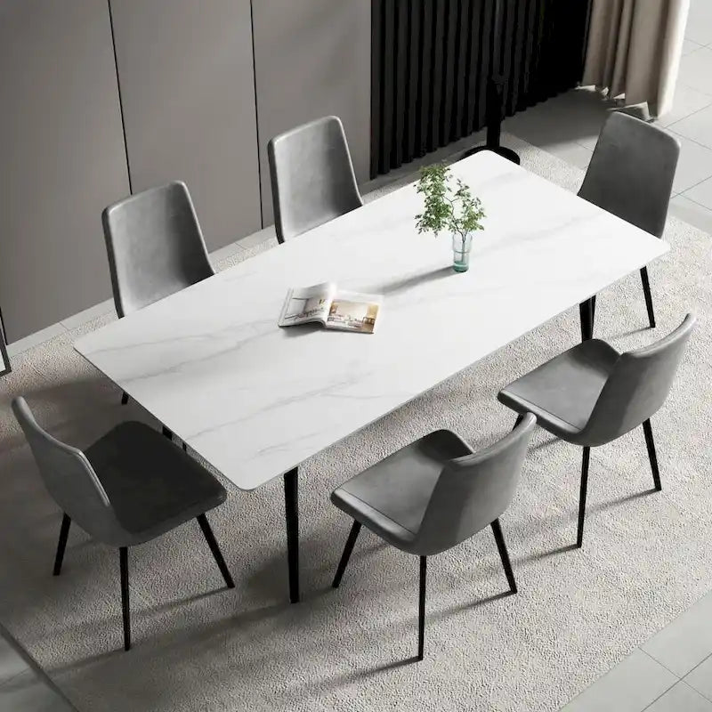 Mesa de comedor rectangular moderna con superficie de piedra y patas de acero negro
